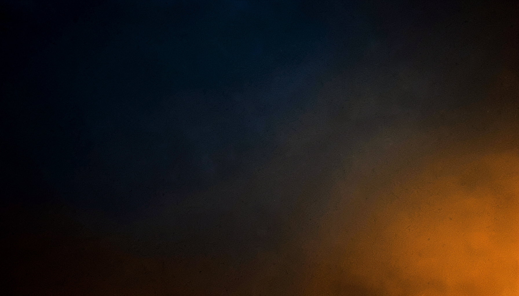 A dark cinematic wide shot with deep blue fading into warm amber at the edges, moody and atmospheric